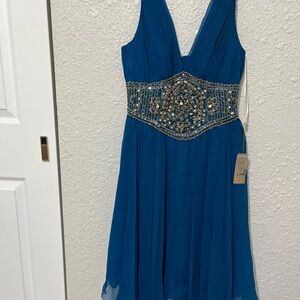 Elegant Blue Sleeveless Dress with Embellished Waist